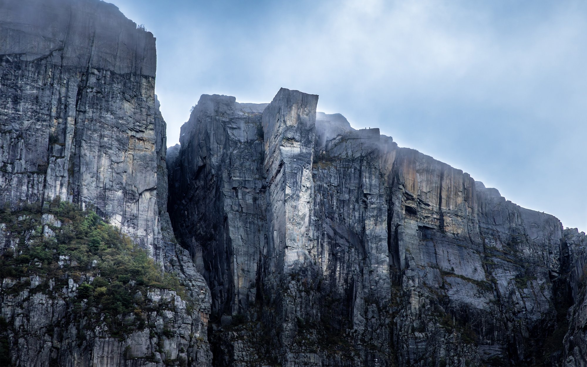 The sheer rock face of Preikestolen seen from the water