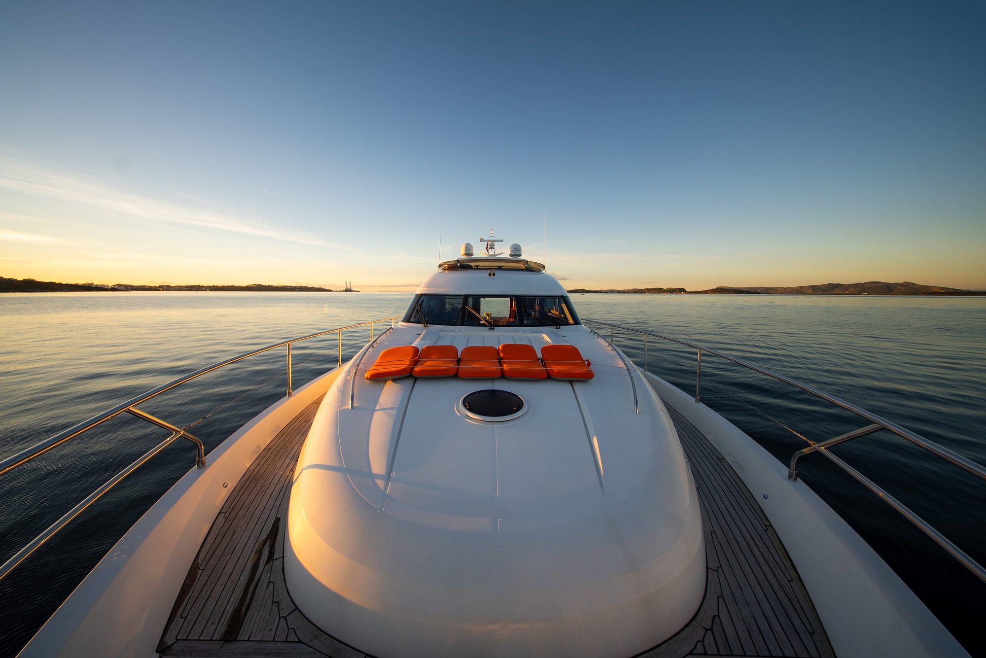The bow of Barolo III at dusk on a calm sea