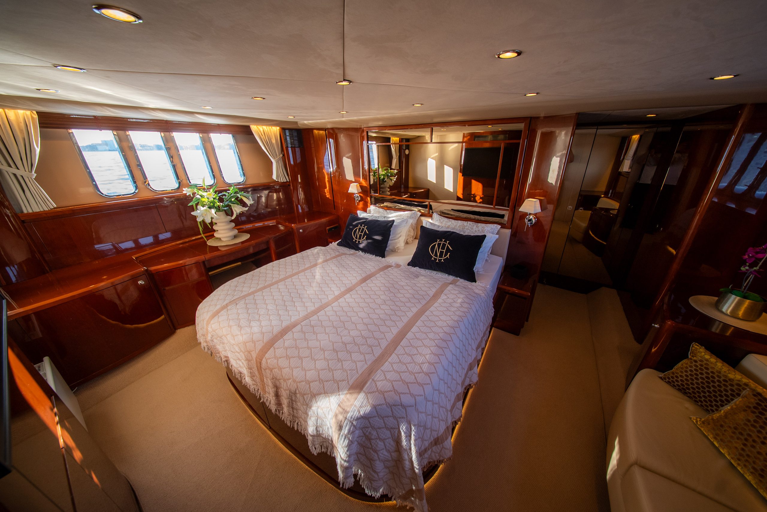 The master stateroom aboard Barolo III, midships, with a double bed and large windows
