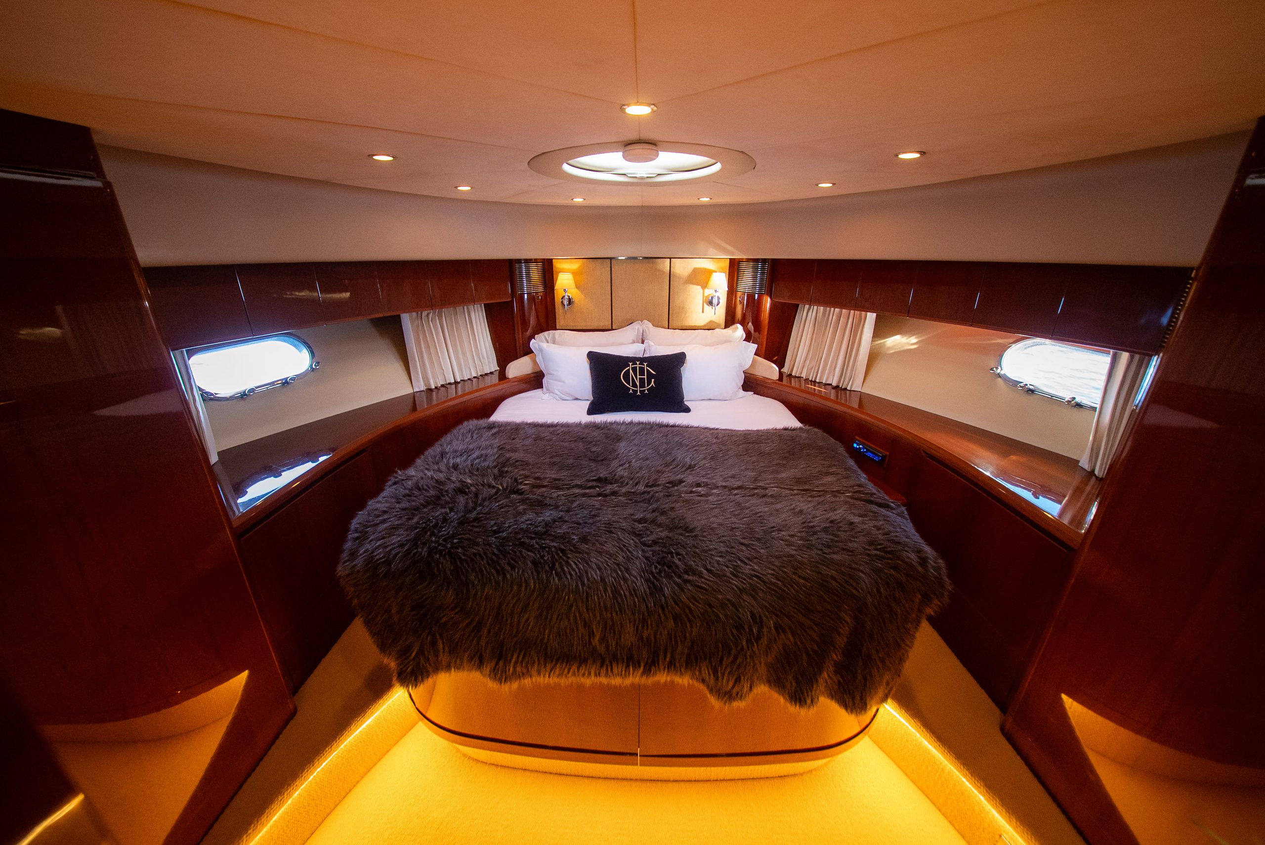 The VIP cabin in the bow of Barolo III, with a double bed beneath a skylight